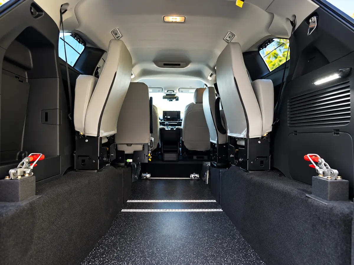 The open, flat floor and tie-down points inside the MedGo Transportation van.