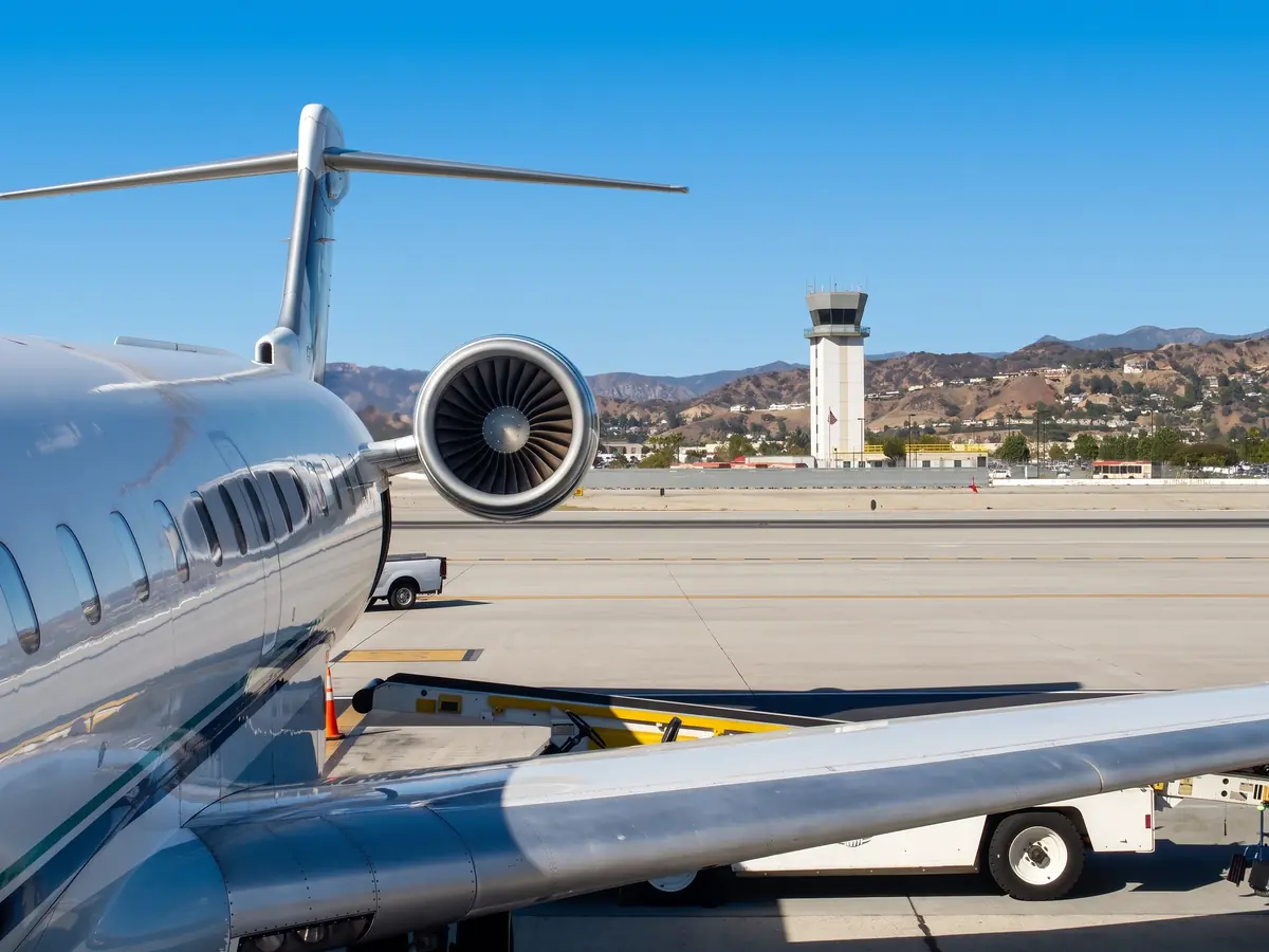 The control tower at Hollywood Burbank Airport, with the hills behind it.